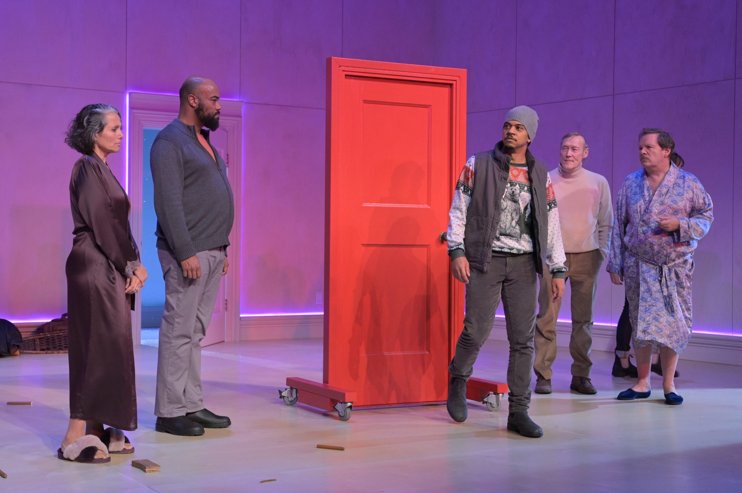 Nora el Samahy (Maria), David Ryan Smith (Edmund), Micah Peoples (Jonathan), James Carpenter (Frank), and Thomas Jay Ryan (Francois) in Berkeley Rep’s production of Charles L. Mee’s Wintertime, directed by Les Waters. The actors stand on stage surrounding a red door