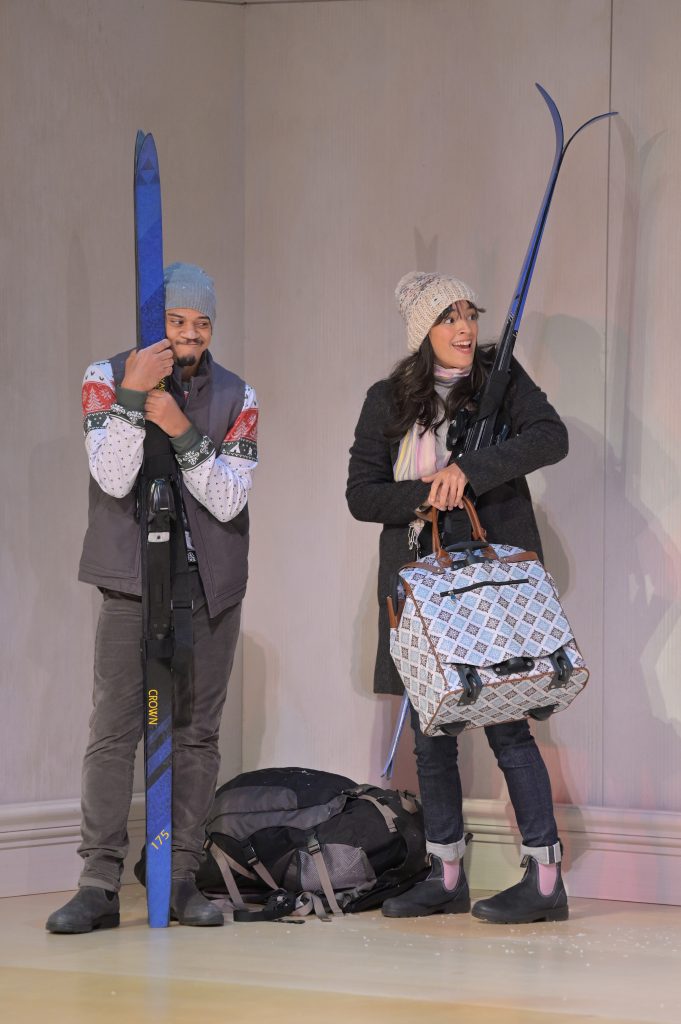 Micah Peoples (Jonathan) and Carmen Berkeley (Ariel) in Berkeley Rep’s production of Charles L. Mee’s Wintertime, directed by Les Waters. The two actors stand on stage holding skis
