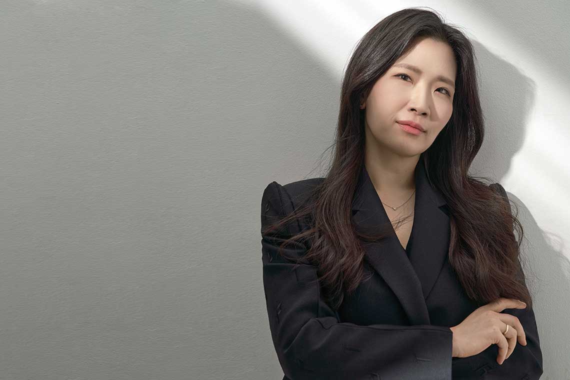 press shot of conductor Eun Sun Kim against a blank background