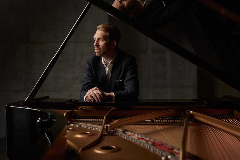 pianist leif ove andsnes sits at the bench of a grand piano