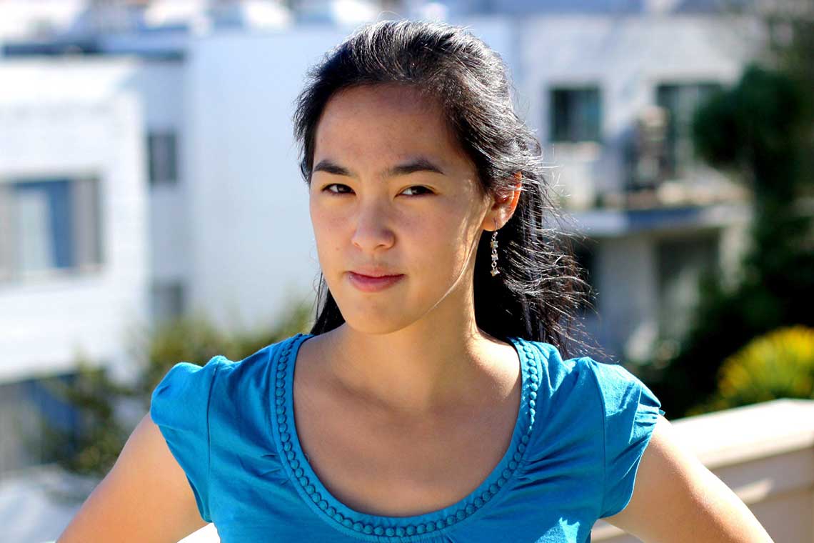 a headshot of playwright Lauren Yee