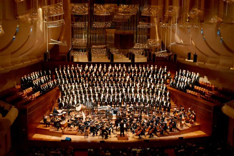 An aerial picture of a large choir and orchestra
