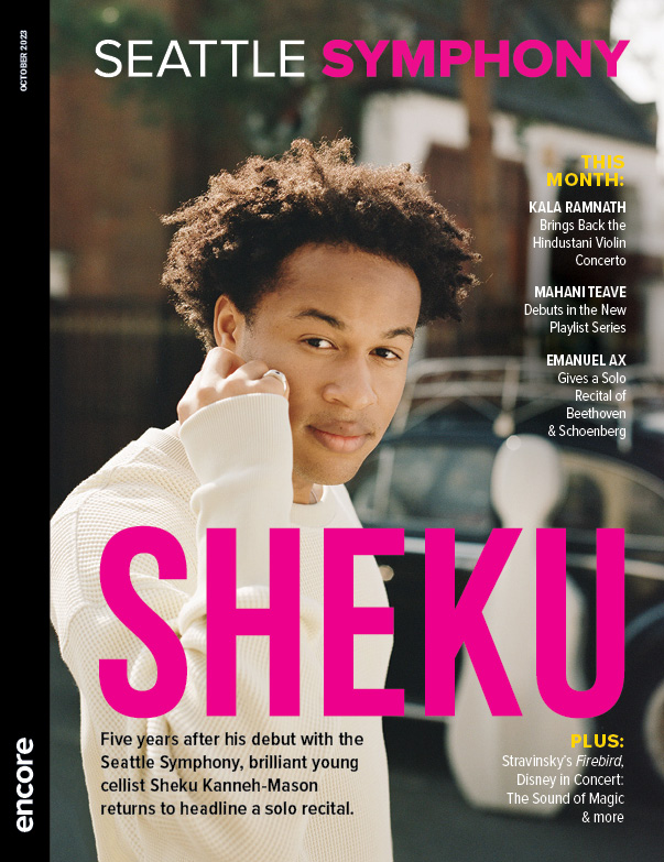 Sheku Kanneh-Mason in a white sweater behind text with his name. | Cover of Seattle Symphony October 2023