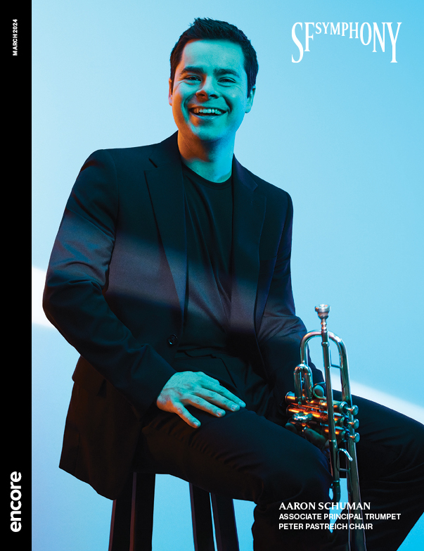Aaron Schuman, Associate Principal Trumpet, Peter Pastreich Chair on a light blue background | Cover of SF Symphony March 2024