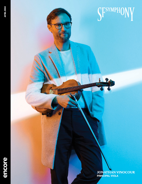 Jonathan Vinocour, Principal Viola, holds his instrument against a blue and pink background | cover of SF Symphony April 2024