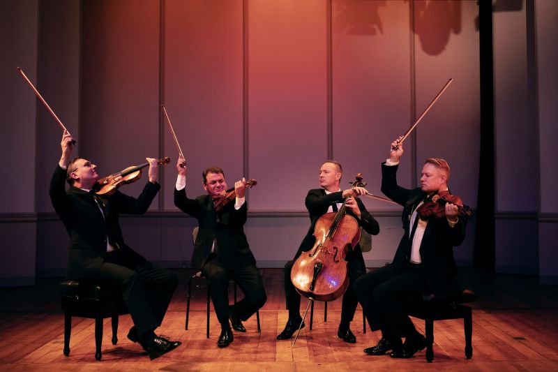 The Jerusalem Quartet plays on a stage with low lighting.