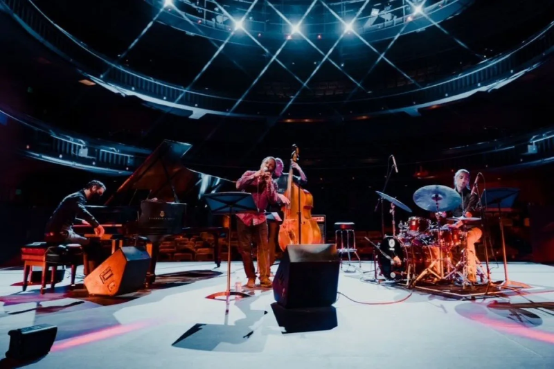 Musicians performing on stage.