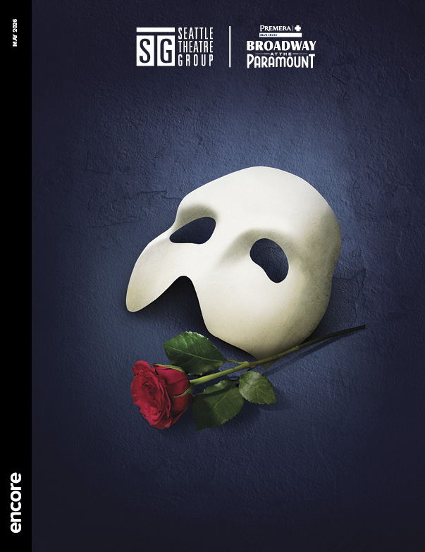 A white stage mask and red rose on a dark blue/black backdrop. | Cover of Phantom of the Opera for Broadway at the Paramount, May 2026