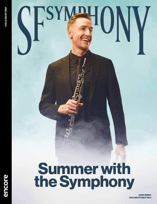 James Button, Associate Principal Oboe holds his instrument in front of a blue sky backdrop. | Cover of "Summer with the Symphony" at SF Symphony, July/August 2026